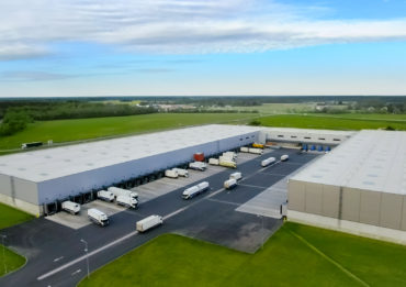 Aerial Shot of Industrial Warehouse/ Storage Building/ Loading A